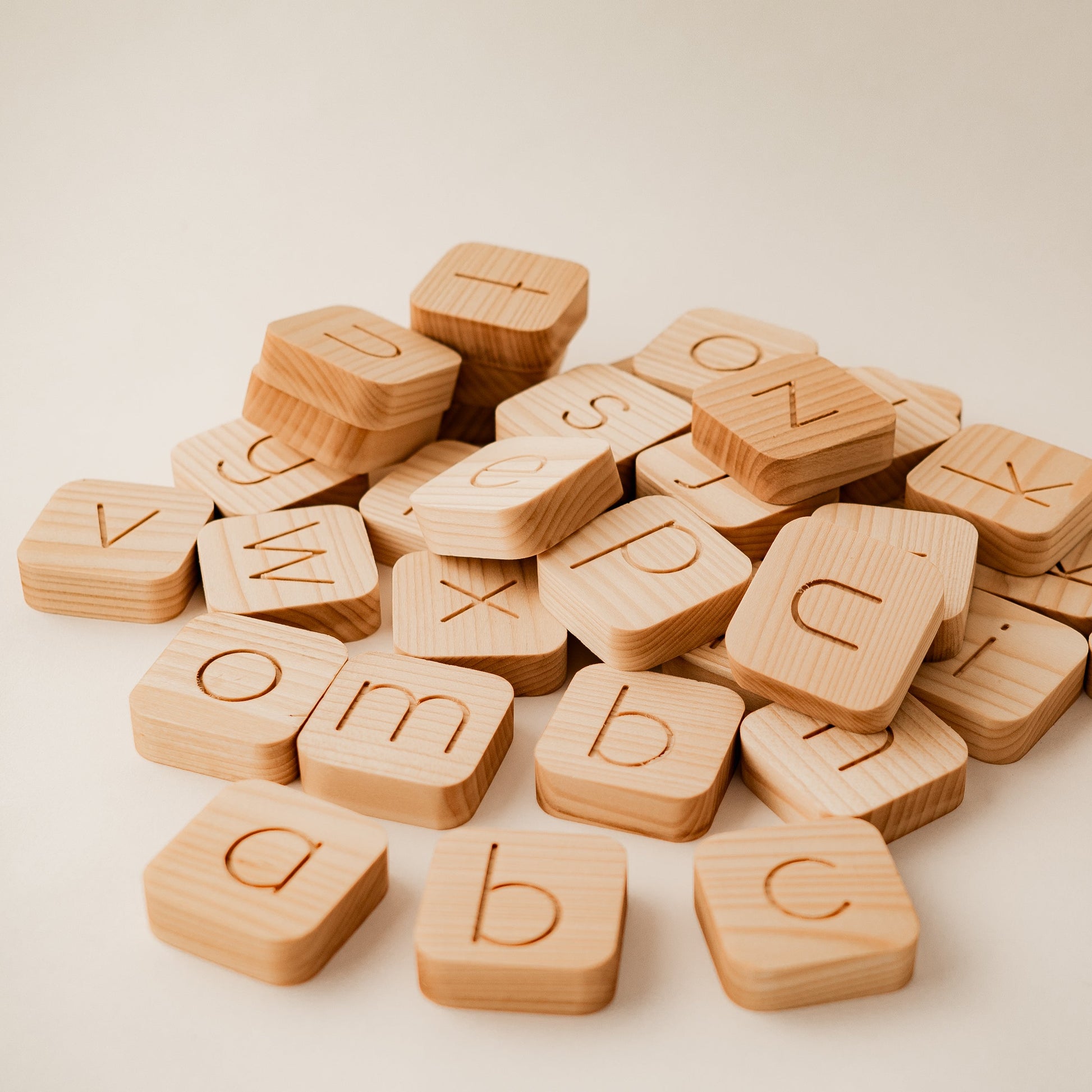 Wooden alphabet blocks on a light background