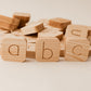Wooden blocks with letters on a light background