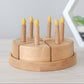 Wooden birthday cake with candles